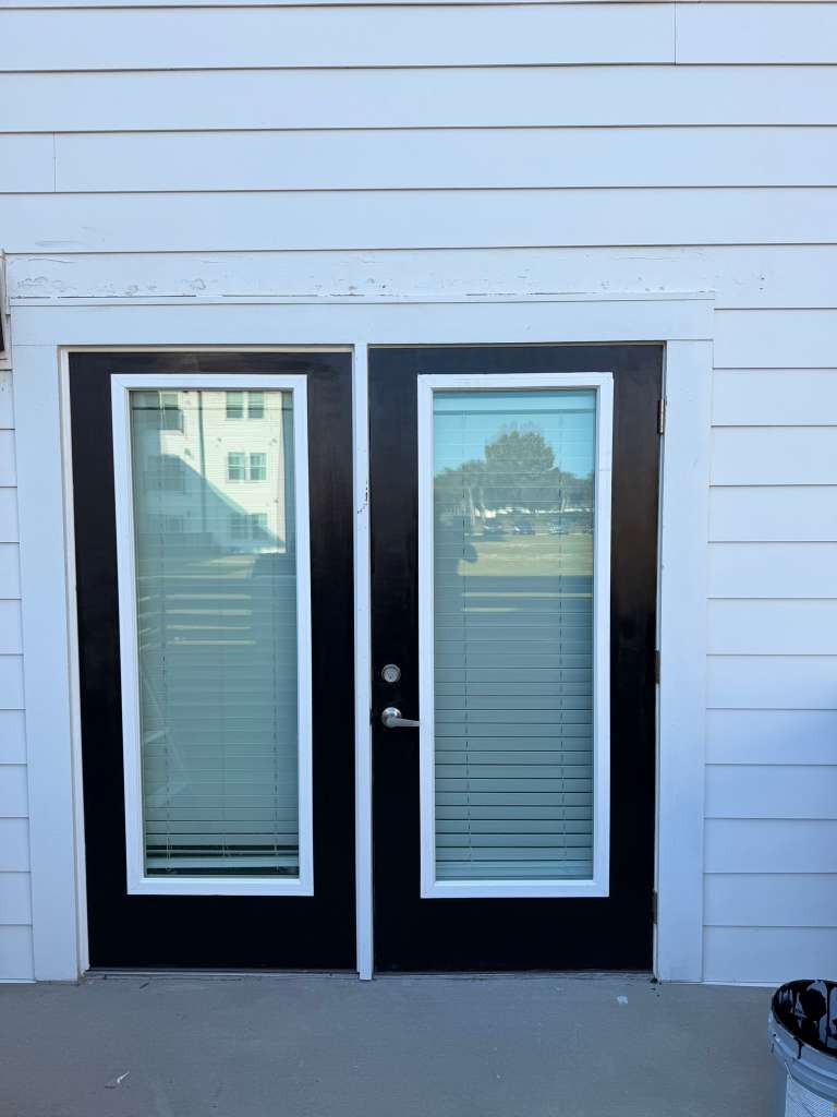 Existing double entry doors before renovation